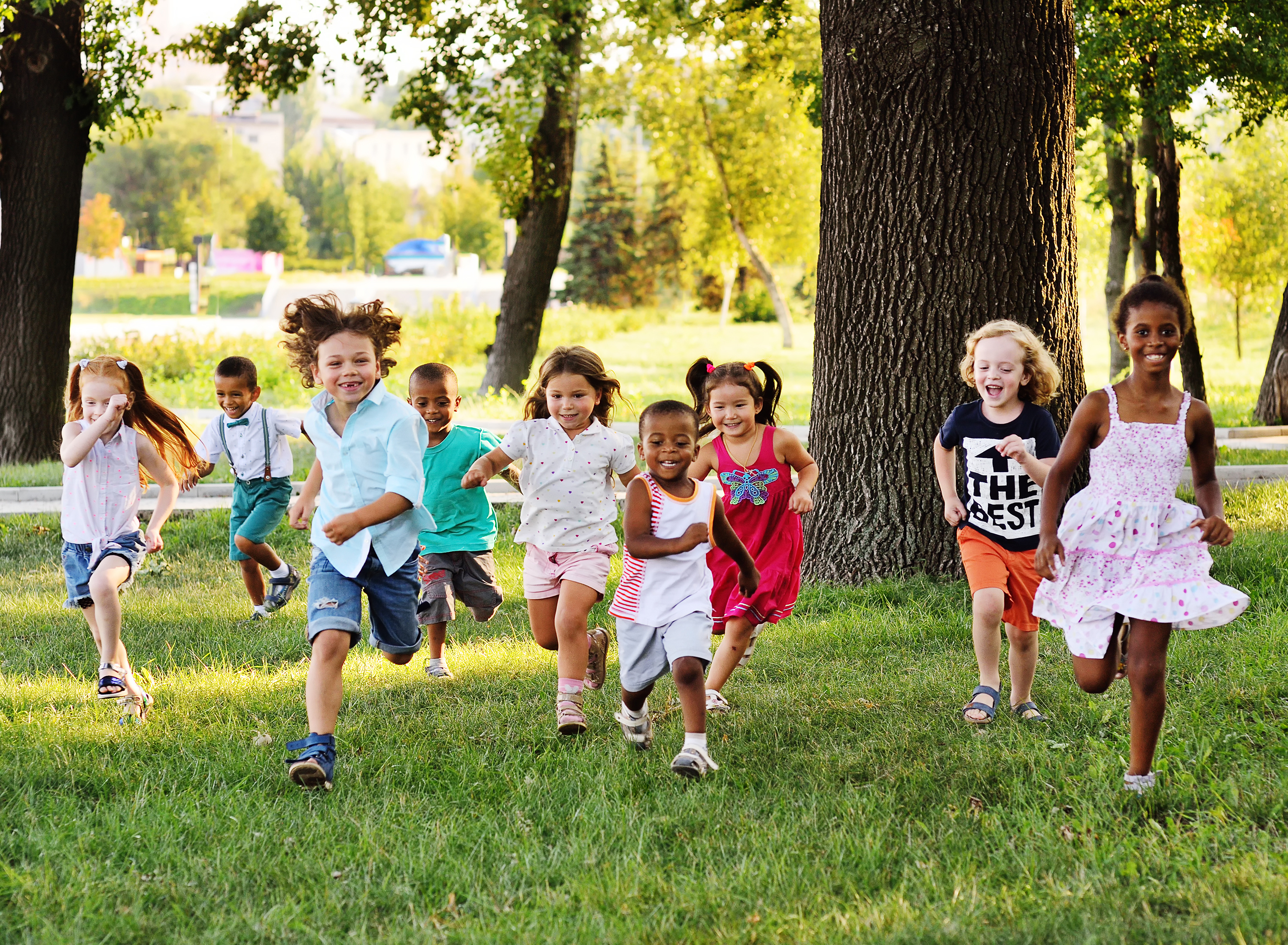 children running in a park setting